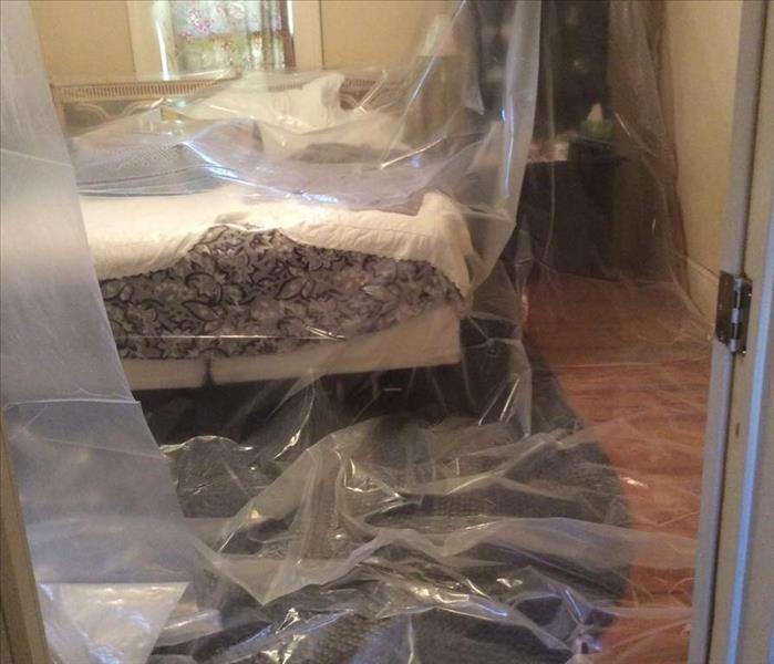 Bedroom Covered in Plastic