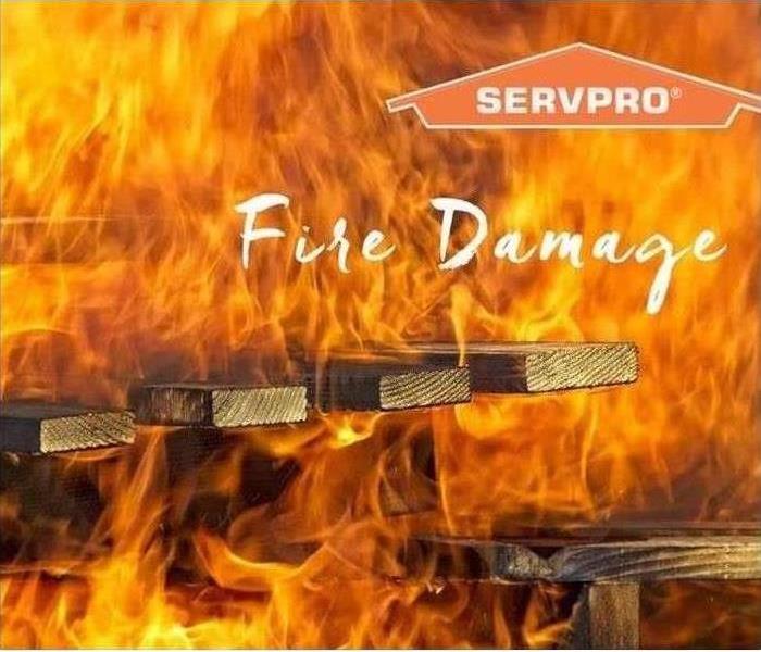 Wood planking on fire with SERVPRO logo