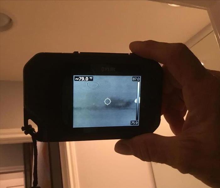 Photo of a thermal imaging camera being used